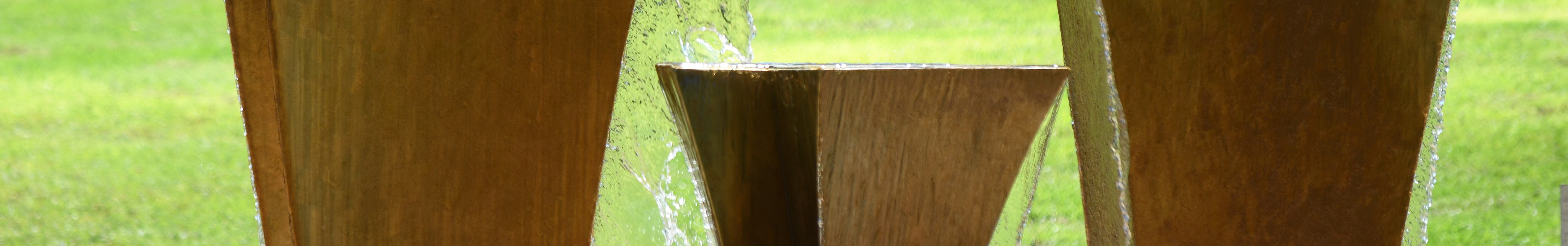 Cubic fountain on grassfield