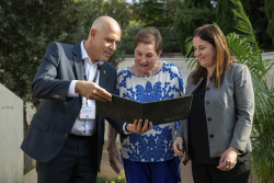 Celebrating Giving:  Marking new inscriptions on the International Plaza Donor Wall