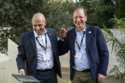 Celebrating Giving:  Marking new inscriptions on the International Plaza Donor Wall
