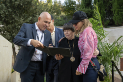 Celebrating Giving:  Marking new inscriptions on the International Plaza Donor Wall