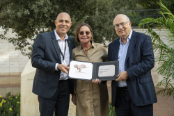 Celebrating Giving:  Marking new inscriptions on the International Plaza Donor Wall