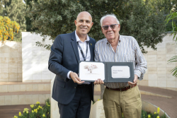 Celebrating Giving:  Marking new inscriptions on the International Plaza Donor Wall