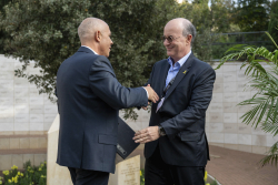 Celebrating Giving:  Marking new inscriptions on the International Plaza Donor Wall