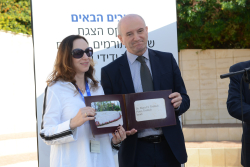 Celebrating Giving: Marking new inscriptions on the International Plaza Donor Wall